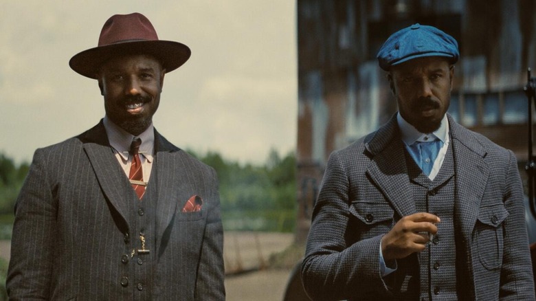 Michael B. Jordan grins as Elias "Stack" "Moore and glowers as Elijah "Smoke" Moore in Sinners