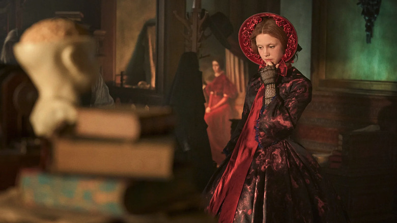 Mia Goth in a red dress in Frankenstein