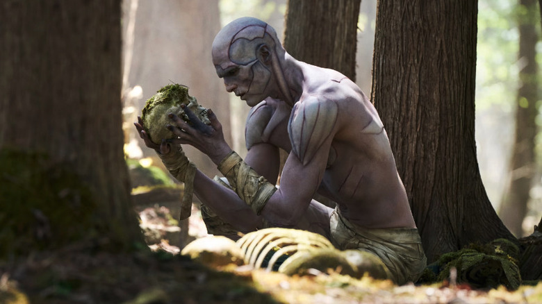 Jacob Elordi as Frankenstein's monster in the woods