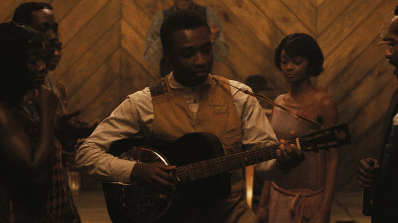 Miles Caton playing guitar in Sinners