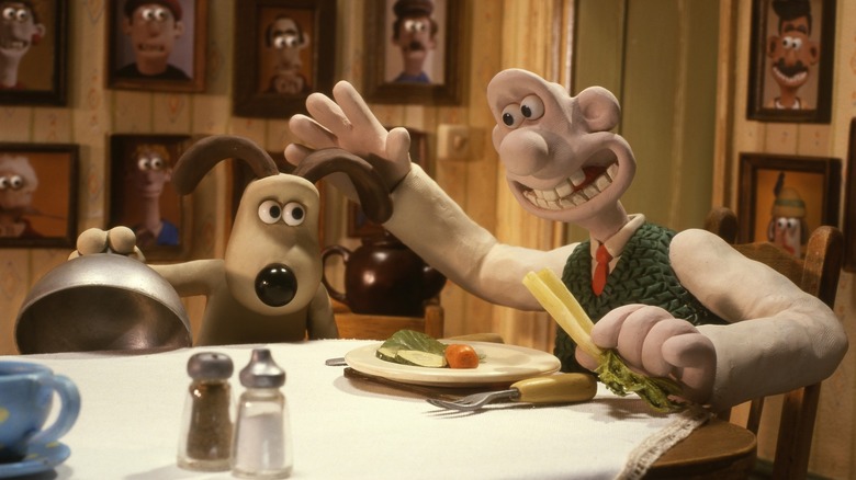 Wallace pats Gromit as he serves him vegetables in Wallace & Gromit: The Curse of the Were-Rabbit