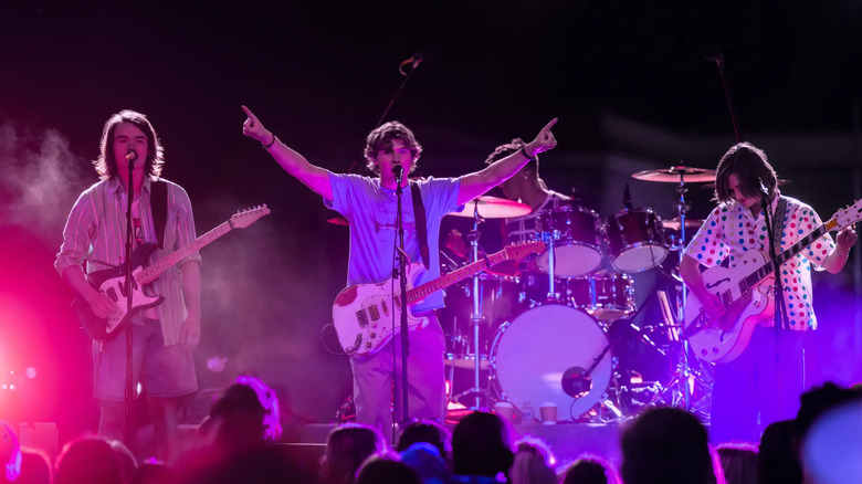 A band performs on-stage on The Runarounds