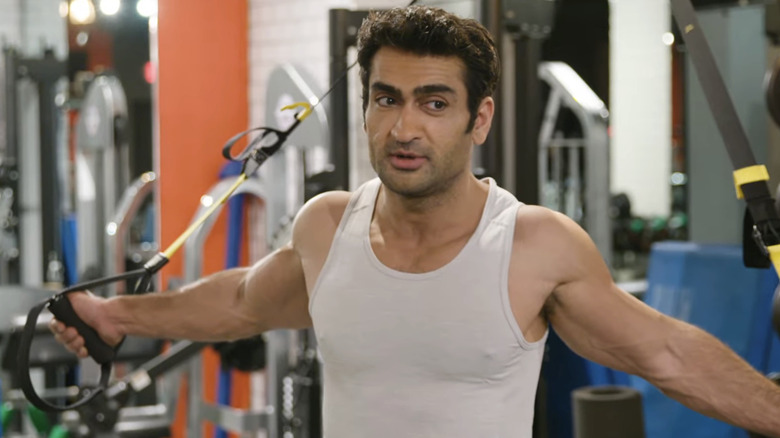 Kumail Nanjiani lifting weights for Men's Health
