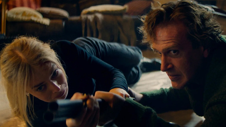 Lisa (Samara Weaving) and Dan (Jason Segel) fight over a shotgun in Over Your Dead Body