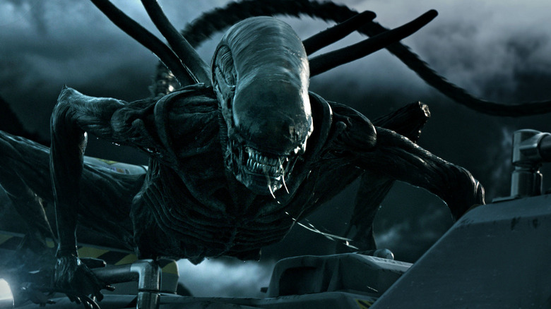 A xenomorph preparing to pounce in Alien: Covenant