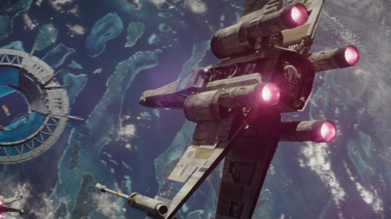An X-wing diving the orbital gate at Scarif in Rogue One
