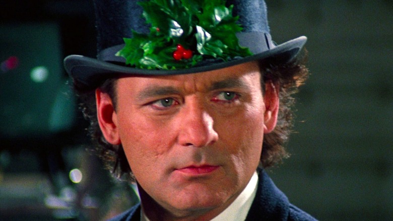 Bill Murray in Scrooged wearing mistletoe hat