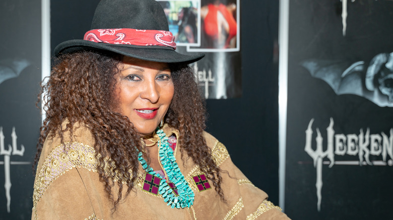 Pam Grier at event wearing hat