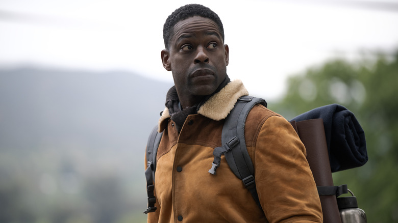 Sterling K. Brown as Xavier wearing a jacket and survival gear in the wilderness in Paradise season 2