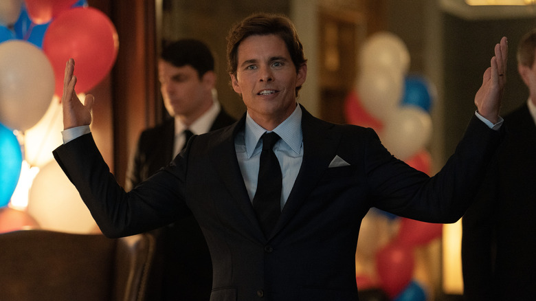 Cal throwing his hands up in the air during a celebration in Paradise