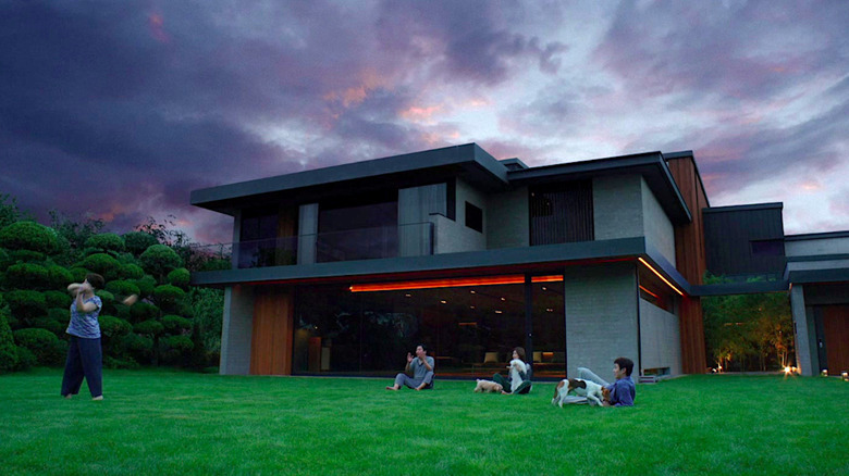 Korean family relaxes on the lawn