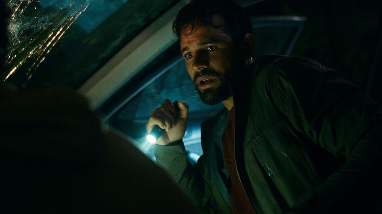 Tyler inspects a car crash in Passenger (2026)