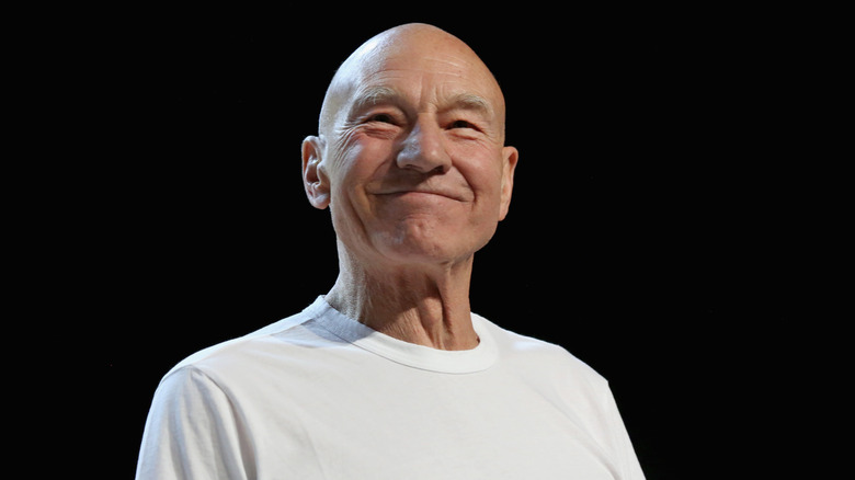 Patrick Stewart on stage, smiling
