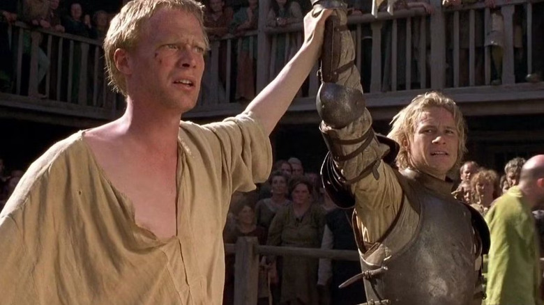Jeffrey Chaucer and Will Thatcher joining hands in an arena in A Knight's Tale