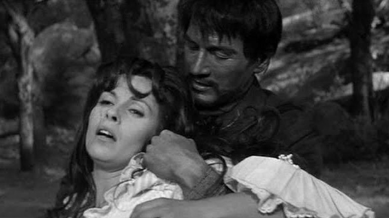 Paul Newman as Juan Carrasco manhandles Claire Bloom as Nina Wakefield in The Outrage