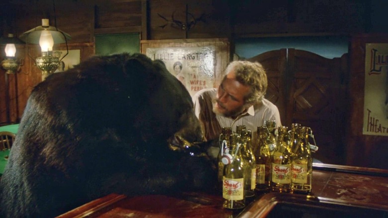 Paul Newman as Judge Roy Bean bellies up to the bar with Bruno the Bear as Zachary Taylor in The Life and Times of Judge Roy Bean