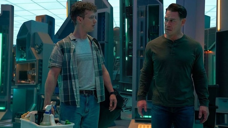 Freddie Stroma as Vigilante and John Cena as Peacemaker wearing civilian clothes on Peacemaker