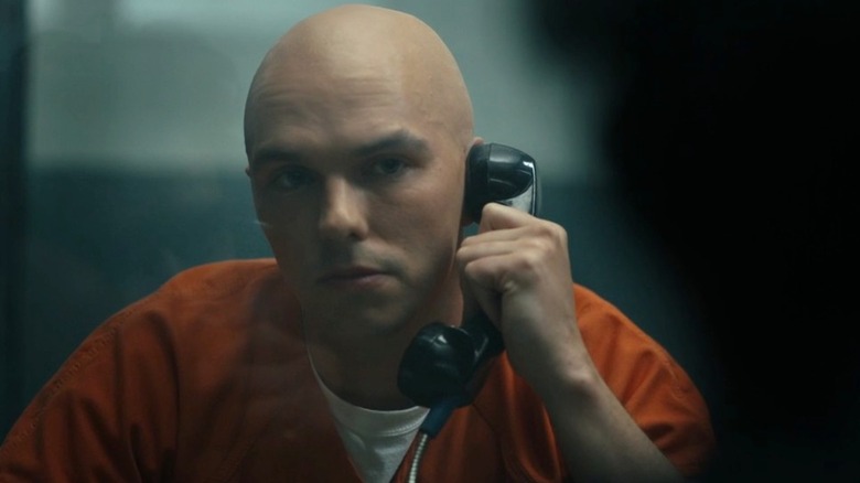 Nicholas Hoult as Lex Luthor on a prison phone in Peacemaker ﻿season 2, episode 6, "Ignorance Is Chris"