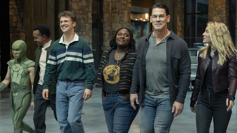 Nhut Lo as Judomaster, Tim Meadows as Langston Fleury, Freddie Stroma as The Vigilante, Daniel Brooks as Leota Adebayo, John Cena as The Peacemaker, and Jennifer Holland as Emilia Harcourt walk into their new office together in The Peacemaker.