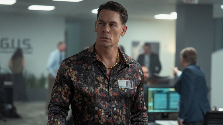 Chris standing in alternate universe ARGUS headquarters in Peacemaker