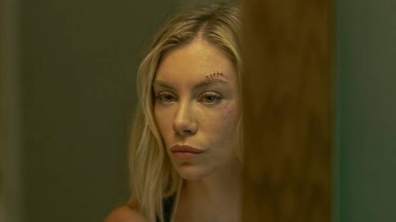 Jennifer Holland's Emilia Harcourt looking serious on Peacemaker