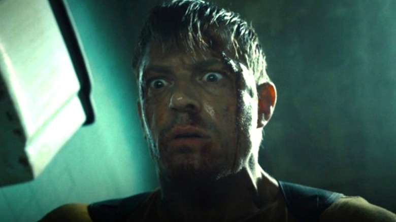 Joel Kinnaman's Rick Flag Jr. looking shocked in The Suicide Squad