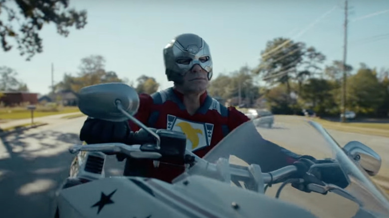Peacemaker rides a motorcycle in Peacemaker season 2