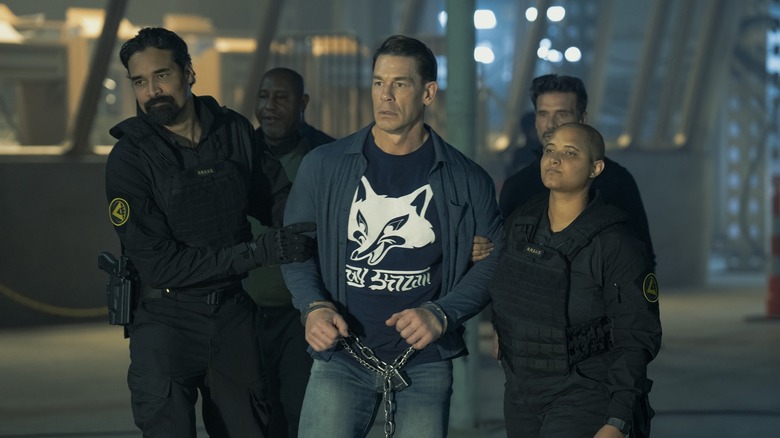 Chris being dragged in chains to an alternate dimension in Peacemaker season 2