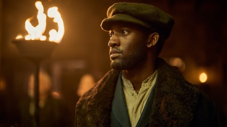 Malachi Kirby looking off camera