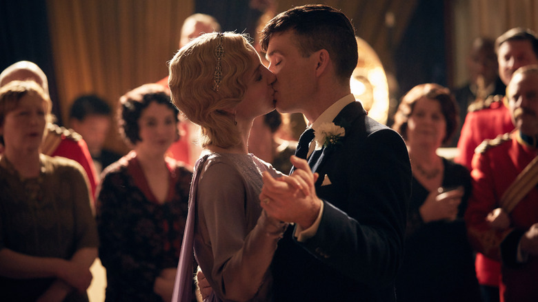 Annabelle Wallis as Grace Burgess kissing and dancing with Cillian Murphy as Tommy Shelby at a ball in Peaky Blinders