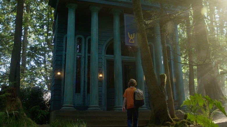 Percy approaches a building with Greek columns
