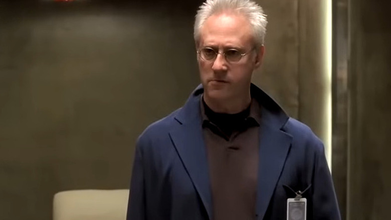 Dr. Nigel Fenway standing up in Threshold