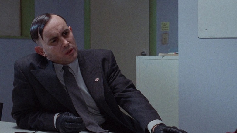 Dammers speaking with Frank Bannister in a police holding cell in The Frighteners