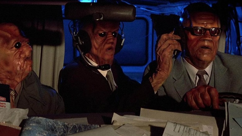 Three leektroids in a van in Buckaroo Banzai adventures