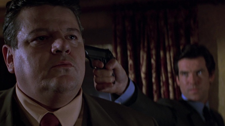 James Bond holding a gun to Valentin Dmitrovich Zukovsky's head, a scene from GoldenEye.
