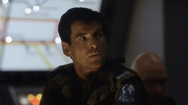Pierce Brosnan's Mike Graham looks off to his left as he stands in a command center in Death Train