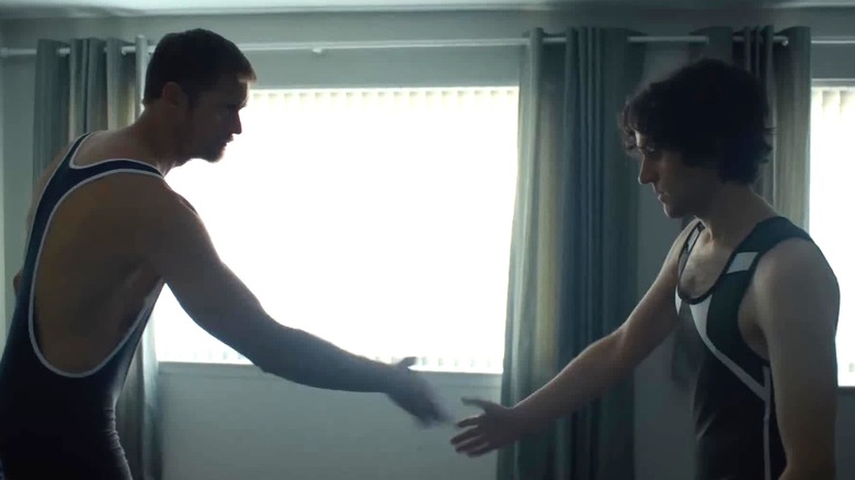 Alexander Skarsgard as Ray about to wrestle Harry Melling as Colin