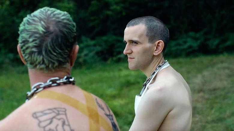 Harry Melling's Colin talking to another submissive in Pillion