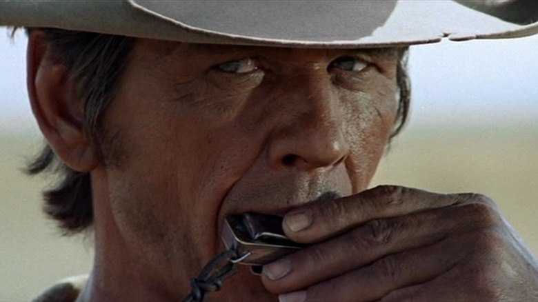 Charles Bronson plays harmonica in Once Upon a Time in the West