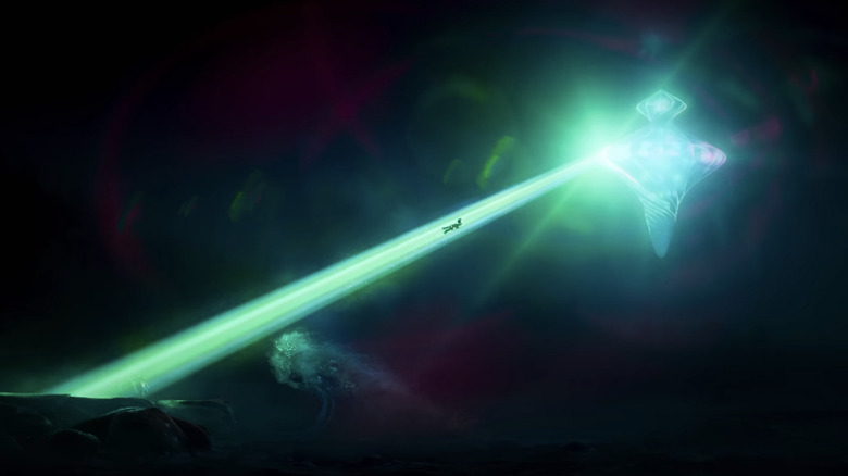 ELIO is pulled through a green beam of light in a crust -like spacecraft