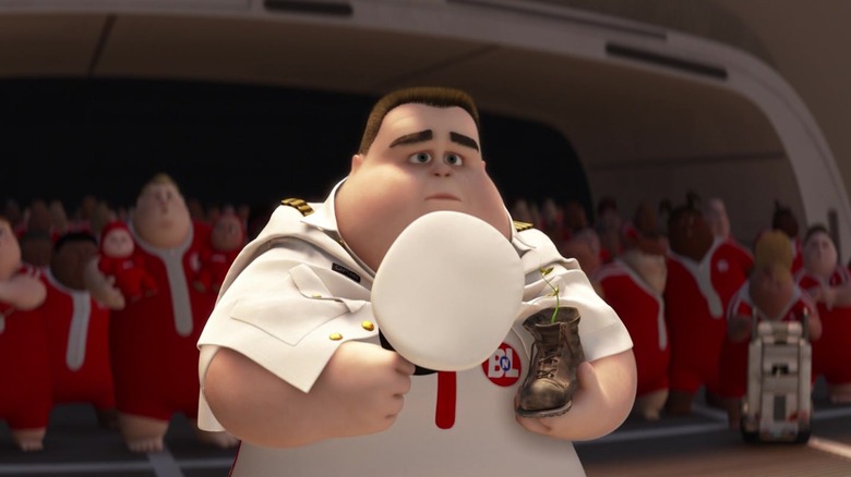 Captain B. McCrea holding a plant in a boot in WALL-E