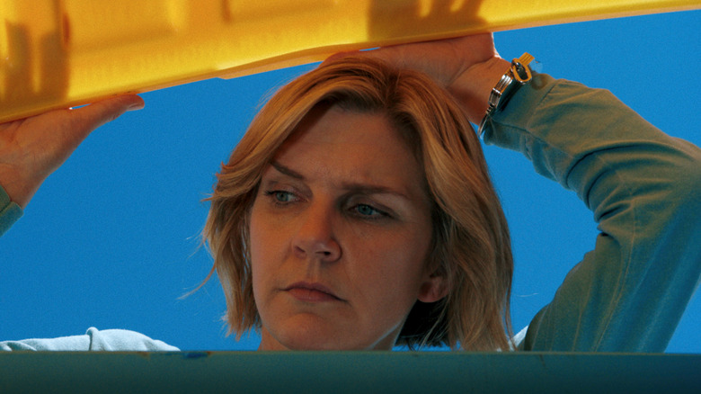 Carol Sturka (Rhea Seehorn) frowns into a dumpster in Pluribus episode 5, 'Got Milk'