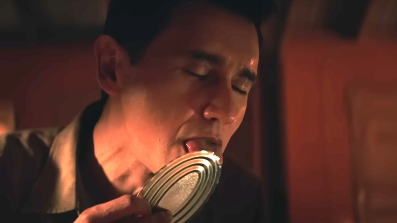 Carlos Manuel Vesga's Manousos licking a food can lid on Pluribus