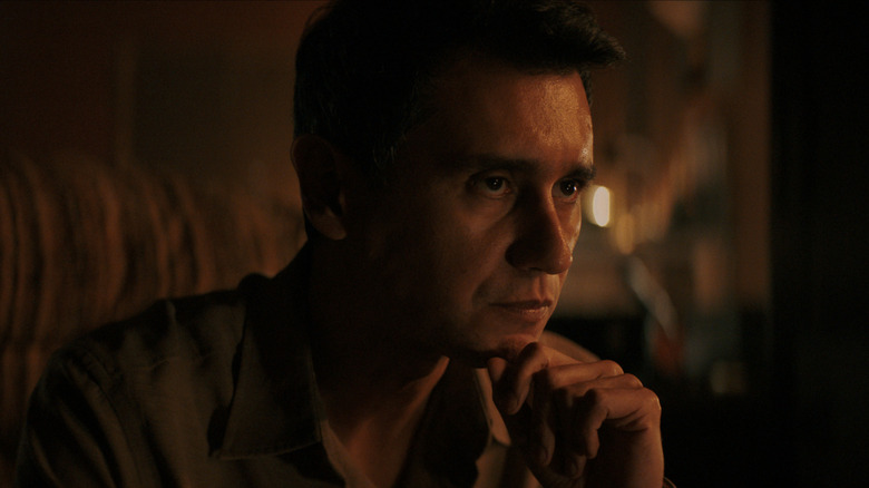 Carlos Manuel Vesga's Manousos looking serious on Pluribus