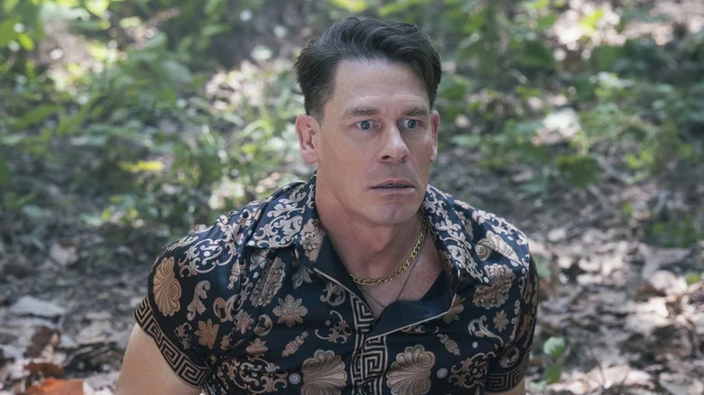 John Cena's Christopher Smith looking surprised while wearing a loud shirt on Peacemaker