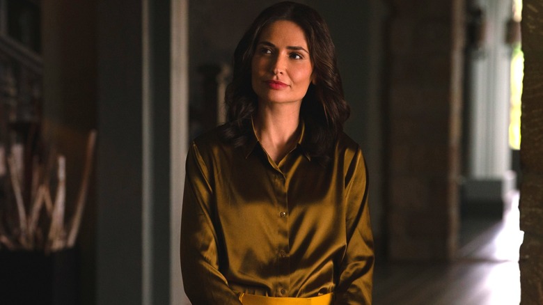 Karolina Wydra as Zosia sitting in a living room on Pluribus