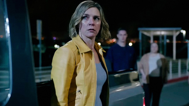Rhea Seehorn as Carol Sturka surrounded by members of 