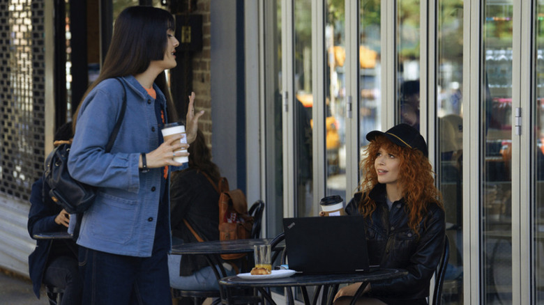 Alex talks to Charlie outside a coffee shop in Poker Face season 2