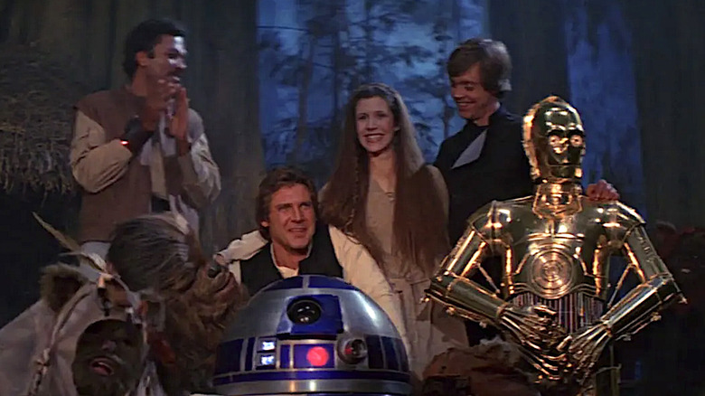 Billy Dee Williams, Peter Mayhew, Harrison Ford, Kenny Baker, Carrie Fisher, Mark Hamill, and Anthony Daniels in Return of the Jedi