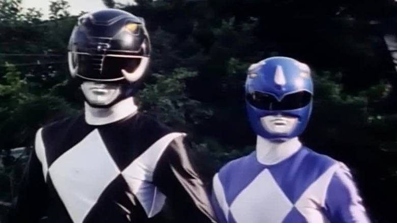 The Black and Blue Ranger get ready to fight in Mighty Morphin Power Rangers